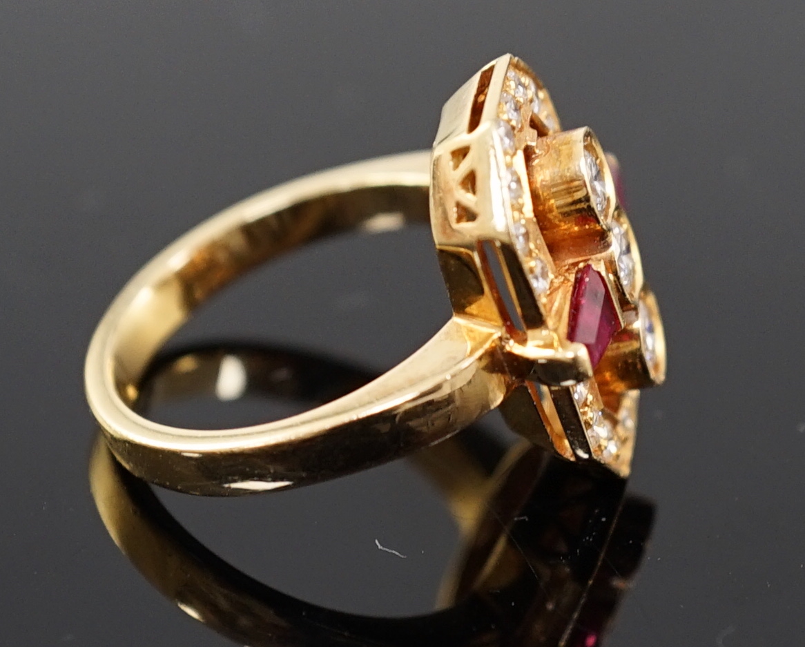 A modern gold, ruby and diamond cluster dress ring